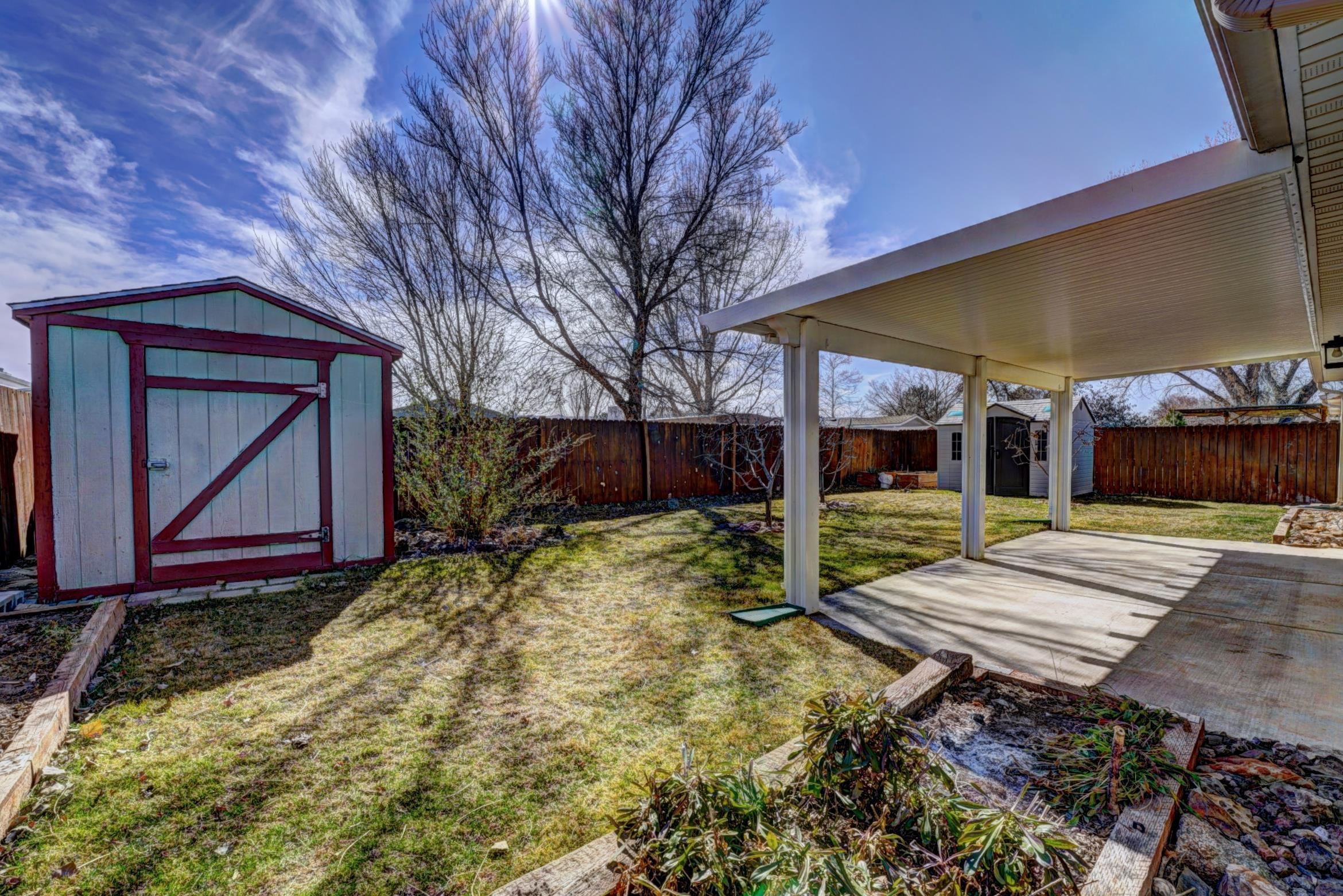 1460 Powell Street Fruita, CO 81521 - Photo 35 of 35 a view of house with backyard space and wooden fence