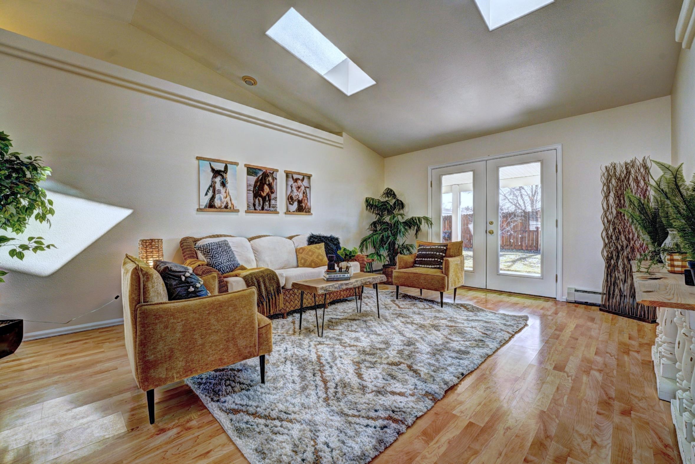 1460 Powell Street Fruita, CO 81521 - Photo 4 of 35 a living room with furniture and wooden floor