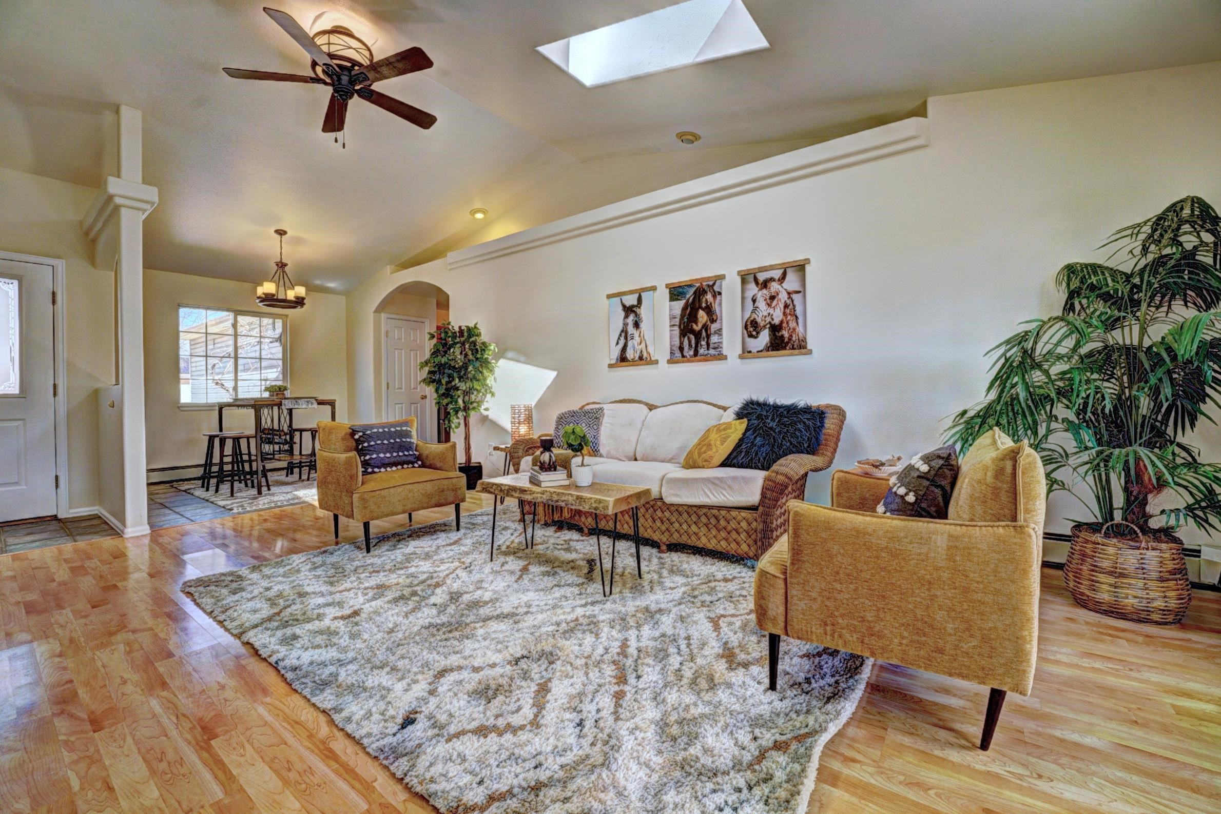 1460 Powell Street Fruita, CO 81521 - Photo 5 of 35 a living room with furniture and a wooden floor