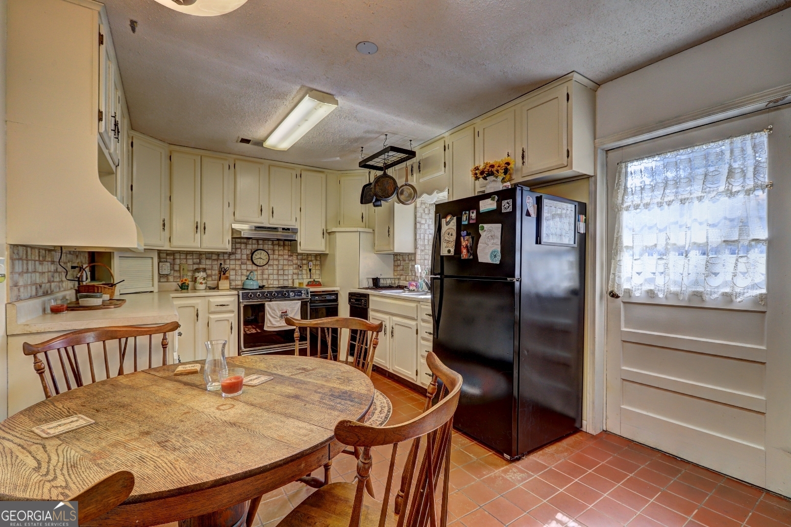 205 Highway 186, Unit TRACT 1 Good Hope, GA 30641 - Photo 11 of 28 a kitchen with stainless steel appliances granite countertop a refrigerator and a stove top oven