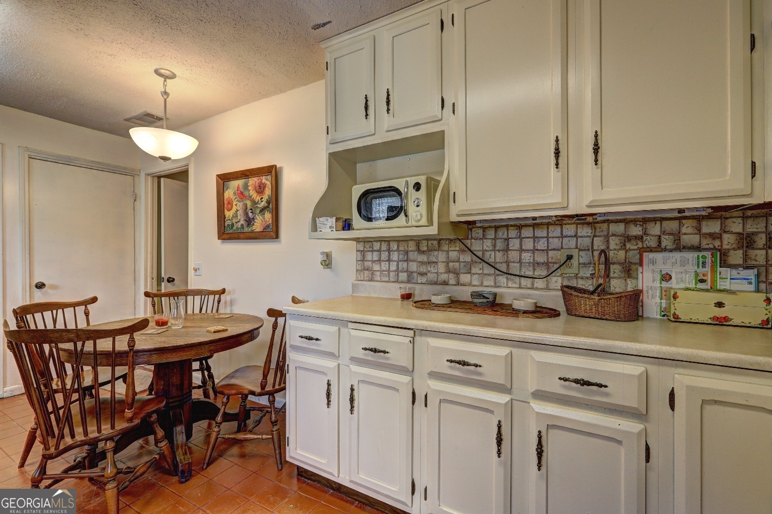 205 Highway 186, Unit TRACT 1 Good Hope, GA 30641 - Photo 12 of 28 a kitchen with cabinets and chairs