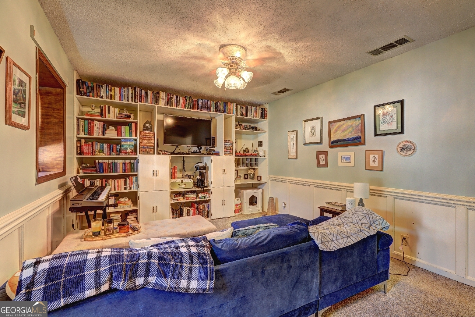 205 Highway 186, Unit TRACT 1 Good Hope, GA 30641 - Photo 15 of 28 a living room with furniture and a flat screen tv