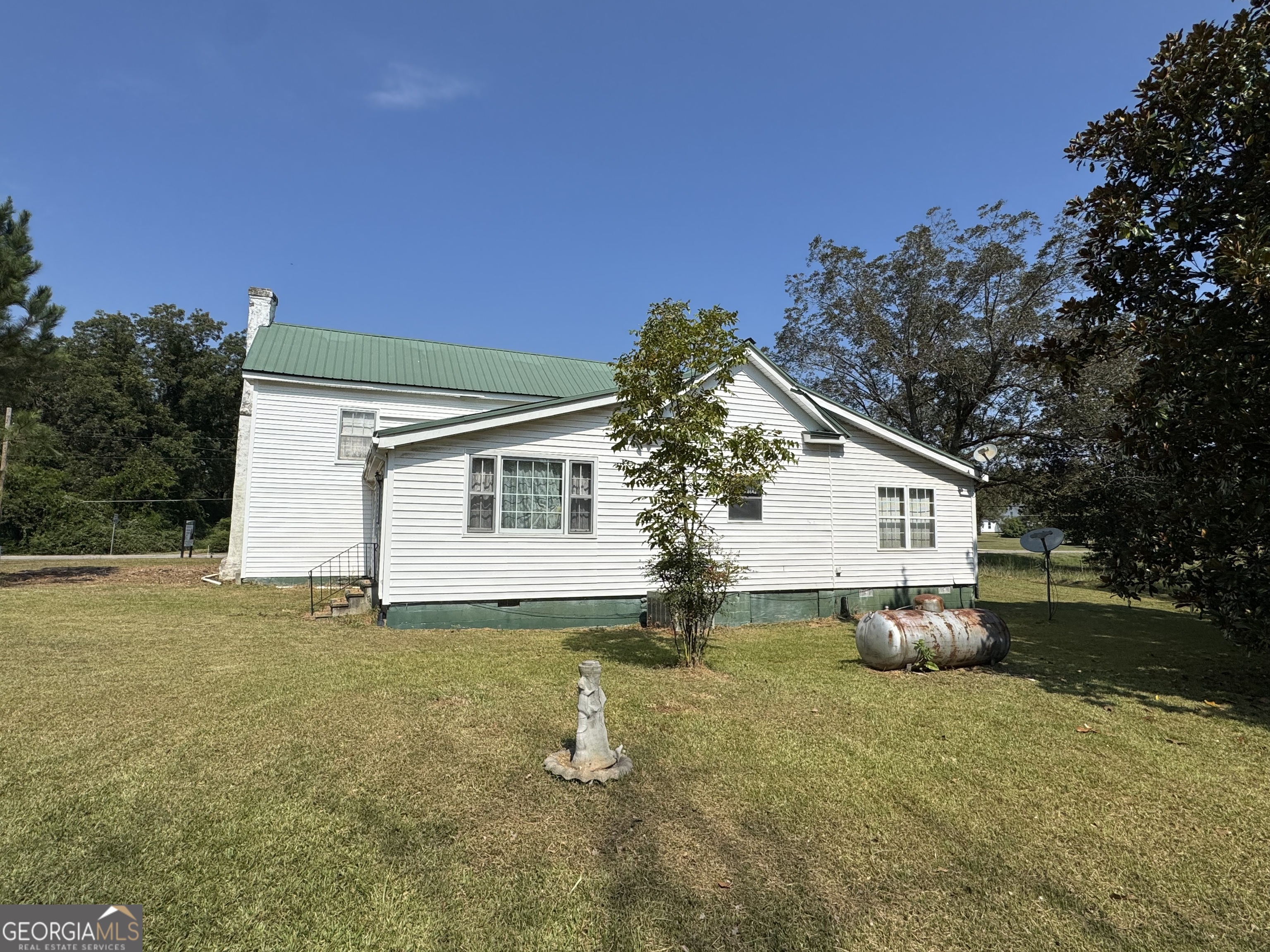 205 Highway 186, Unit TRACT 1 Good Hope, GA 30641 - Photo 5 of 28 a view of a house with backyard and trees