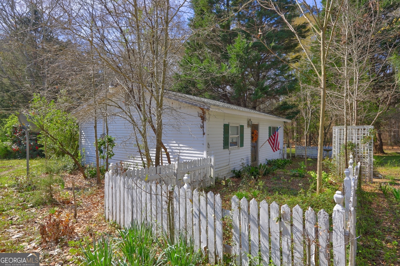 205 Highway 186, Unit TRACT 1 Good Hope, GA 30641 - Photo 10 of 28 a front view of a house with a yard