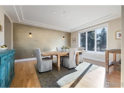 a living room with lots of furniture and a large window