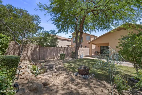 a view of a house with backyard porch and sitting area