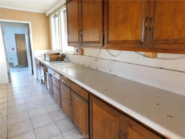 a bathroom with a sink and a large window