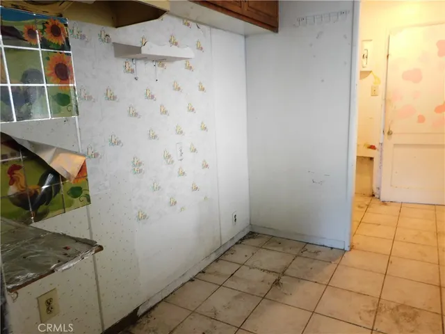 a view of an empty room with a closet