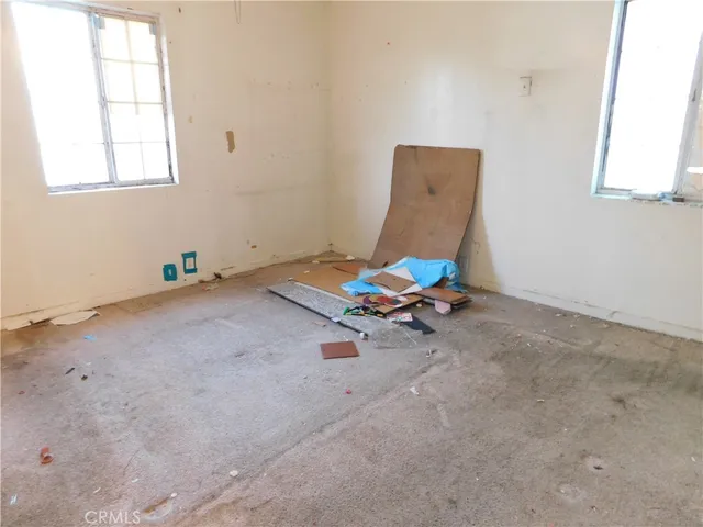 a bathroom with a granite countertop sink a toilet and a bathtub