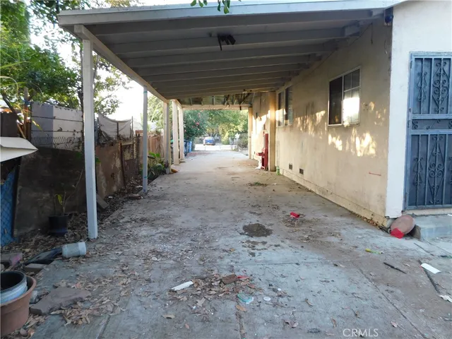 a view of a backyard with plants and lake view