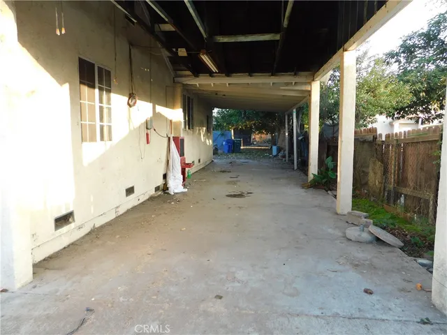a house is covered with snow in a yard