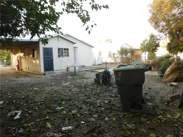 a view of a fire pit with large trees