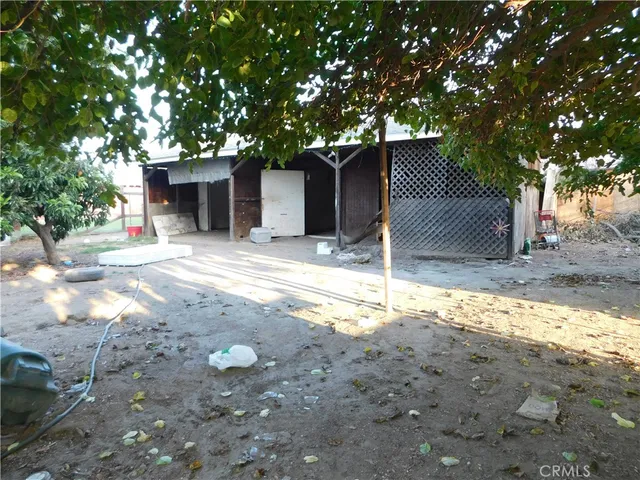 a view of a backyard of the house