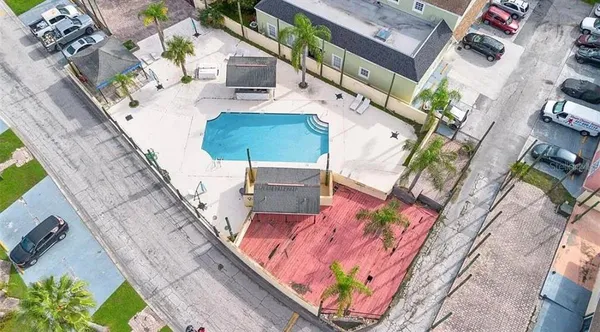 an aerial view of a house with outdoor space