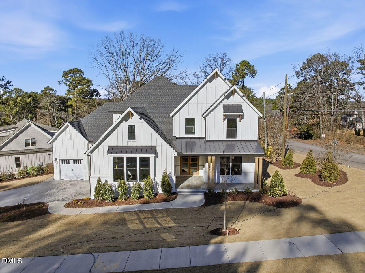 8729 Allison Road Cedar Grove, NC 27231 - Photo 1 of 63 a front view of a house with garden