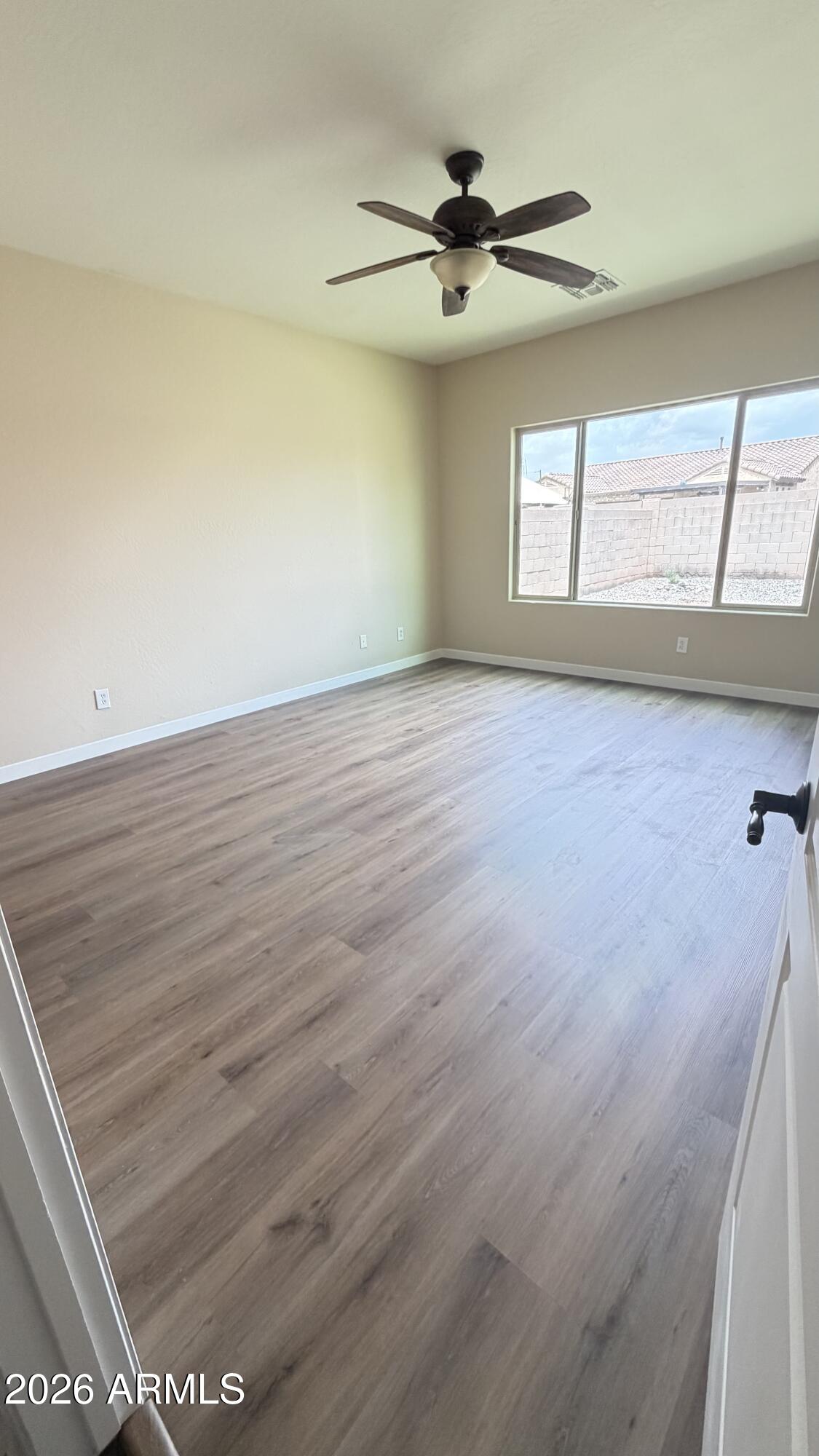 10786 West Yearling Road Peoria, AZ 85383 - Photo 11 of 21 a view of an empty room with a window