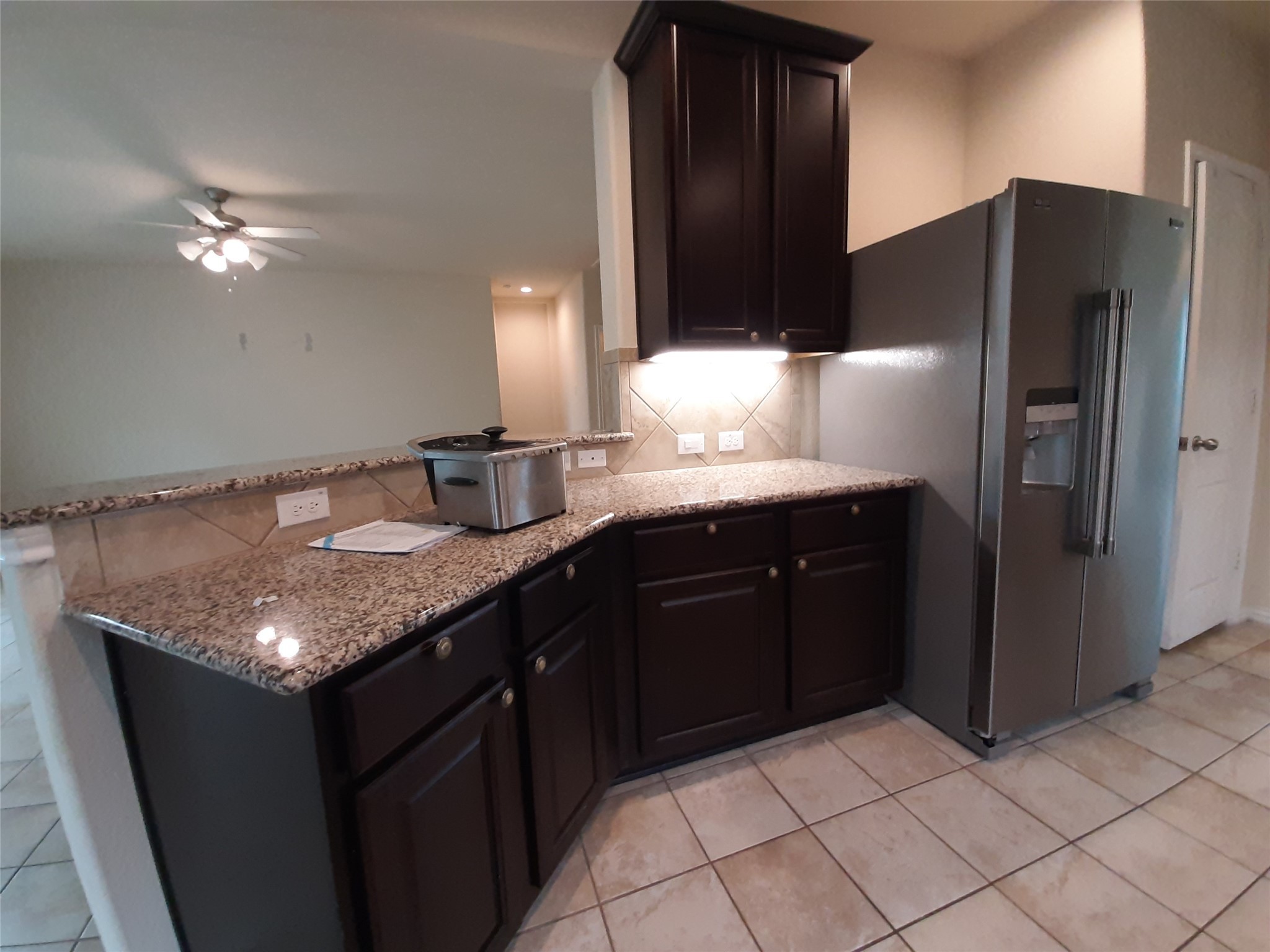 22830 Highland Bluff Lane Spring, TX 77373 - Photo 15 of 39 a kitchen with stainless steel appliances granite countertop a sink and a refrigerator