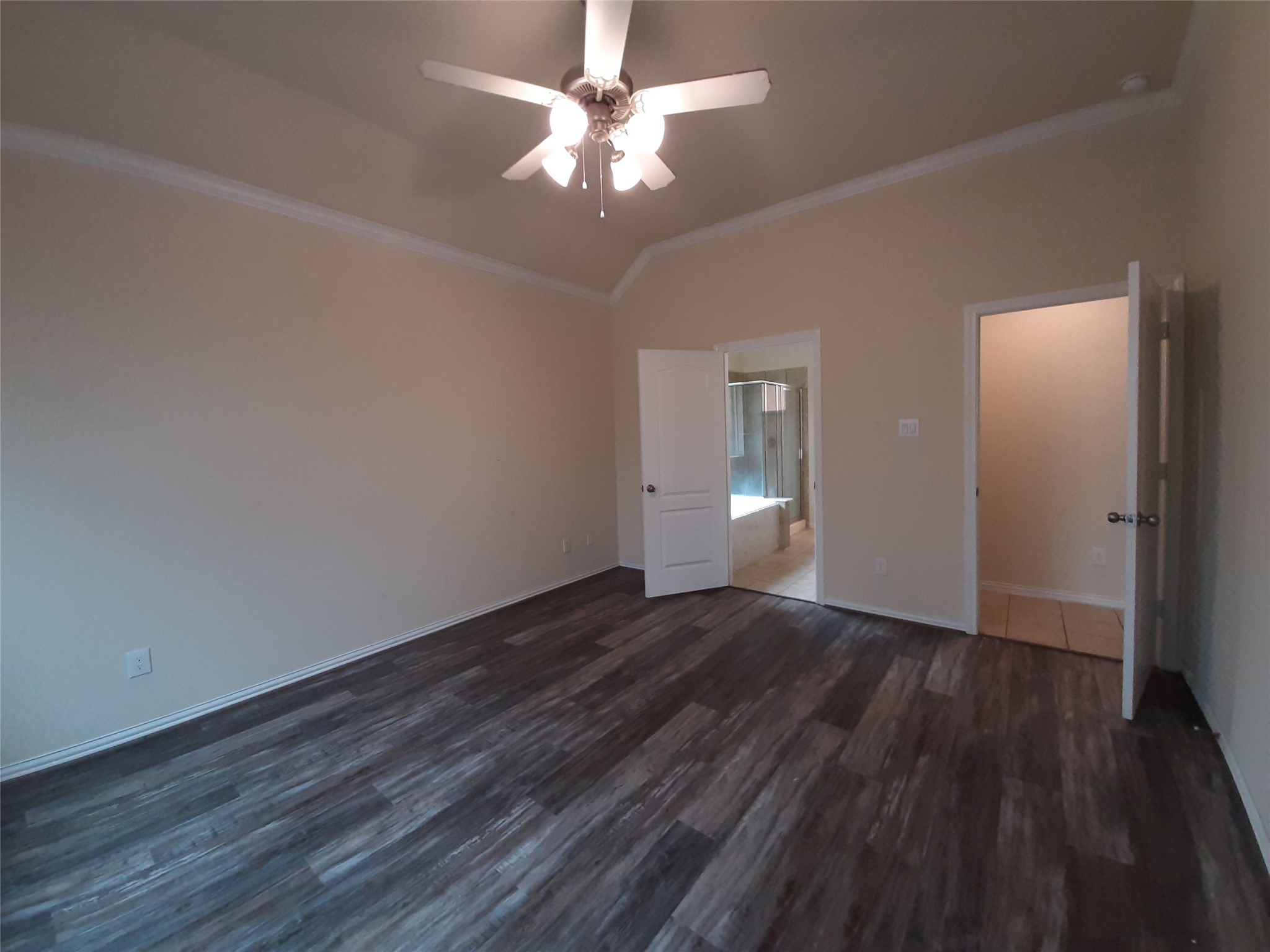 22830 Highland Bluff Lane Spring, TX 77373 - Photo 20 of 39 a view of an empty room with wooden floor and a ceiling fan