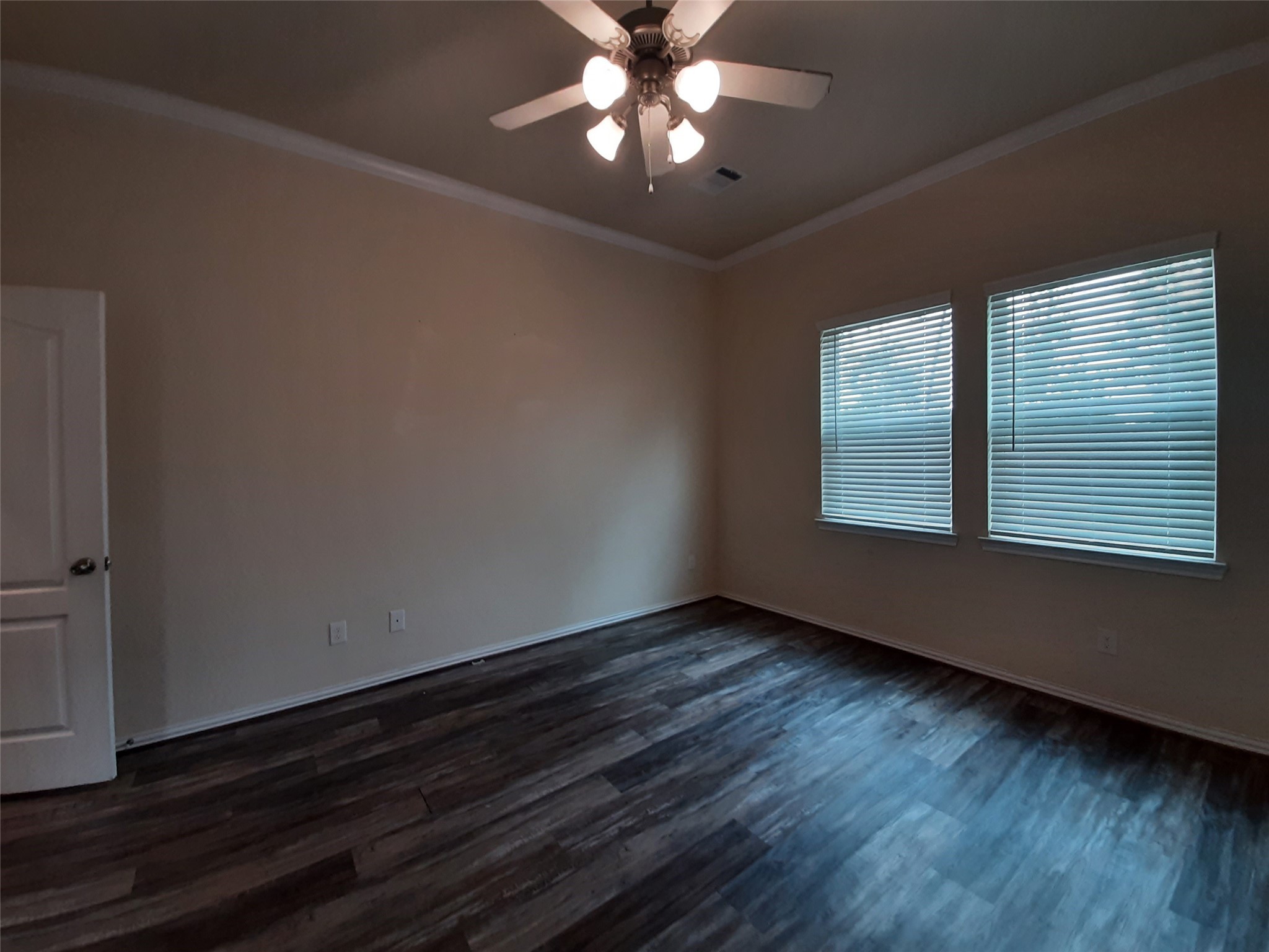 22830 Highland Bluff Lane Spring, TX 77373 - Photo 21 of 39 a view of an empty room with wooden floor and a window