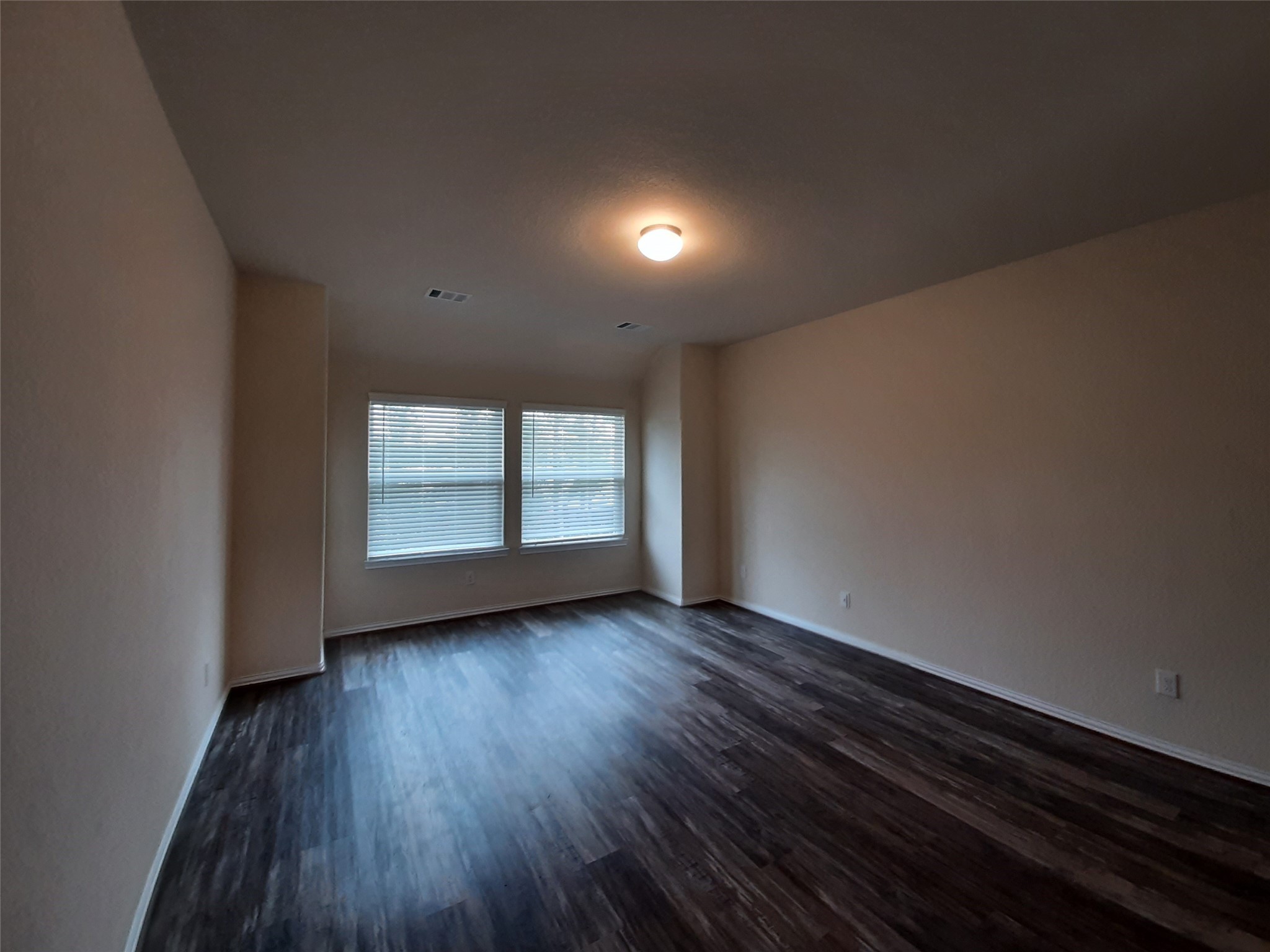 22830 Highland Bluff Lane Spring, TX 77373 - Photo 25 of 39 a view of an empty room with wooden floor and a window