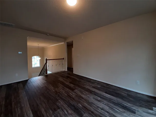 a view of a big room with wooden floor