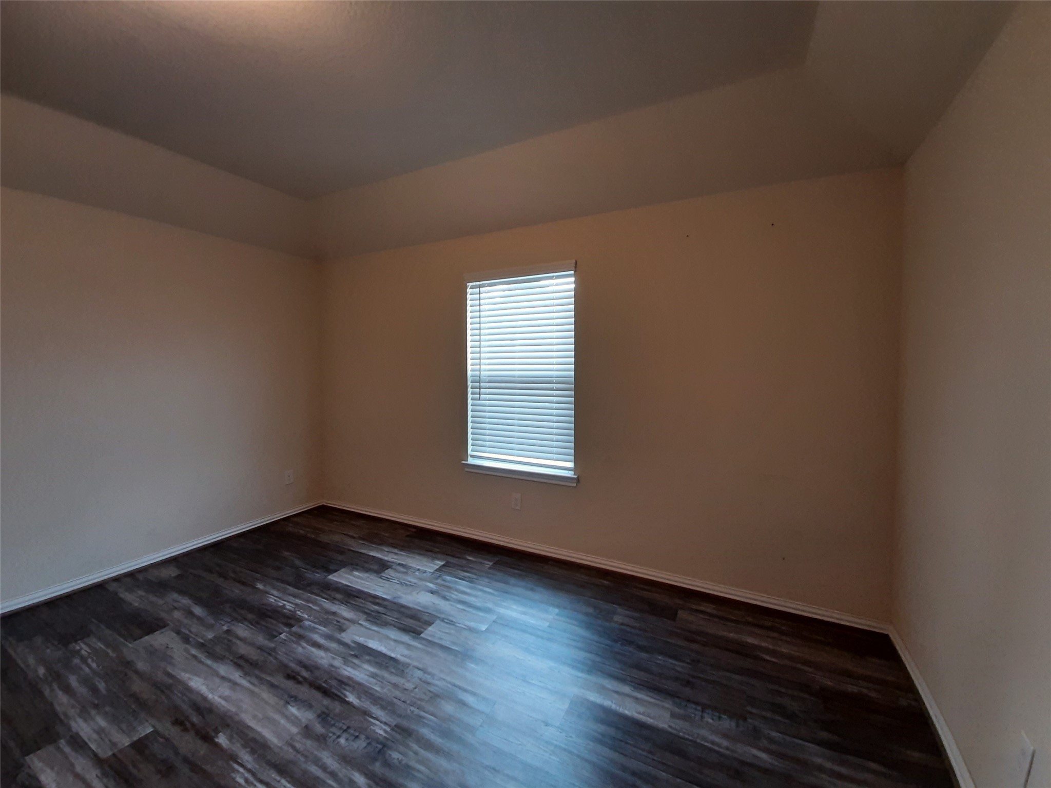 22830 Highland Bluff Lane Spring, TX 77373 - Photo 28 of 39 a view of an empty room with wooden floor and a window