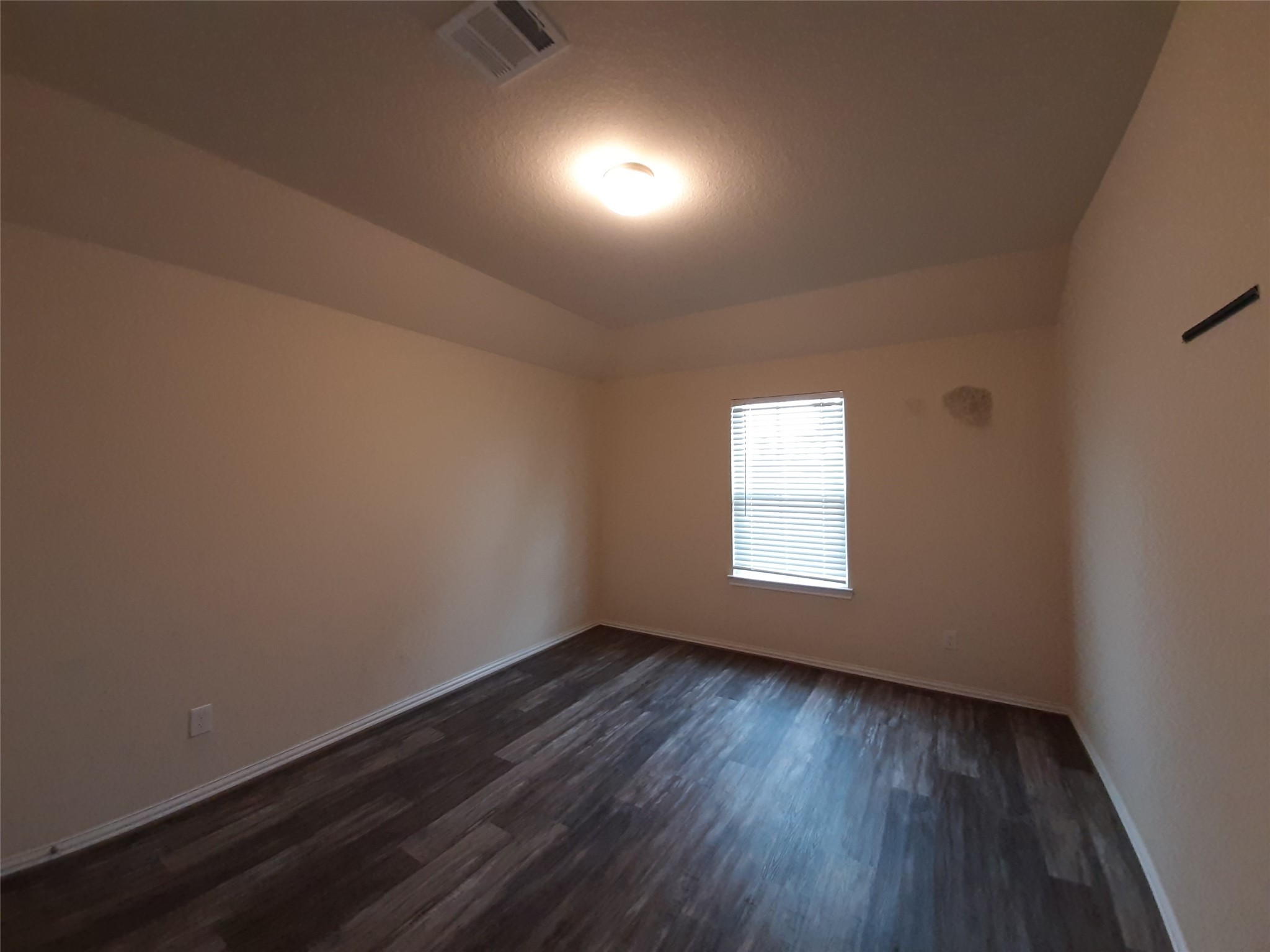 22830 Highland Bluff Lane Spring, TX 77373 - Photo 30 of 39 an empty room with wooden floor and windows