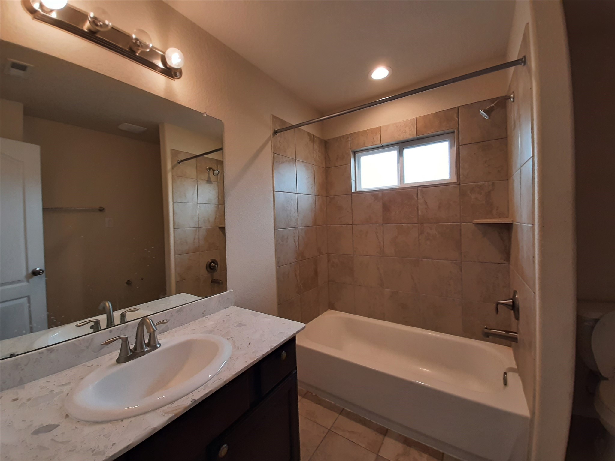 22830 Highland Bluff Lane Spring, TX 77373 - Photo 33 of 39 a bathroom with a bathtub and a sink