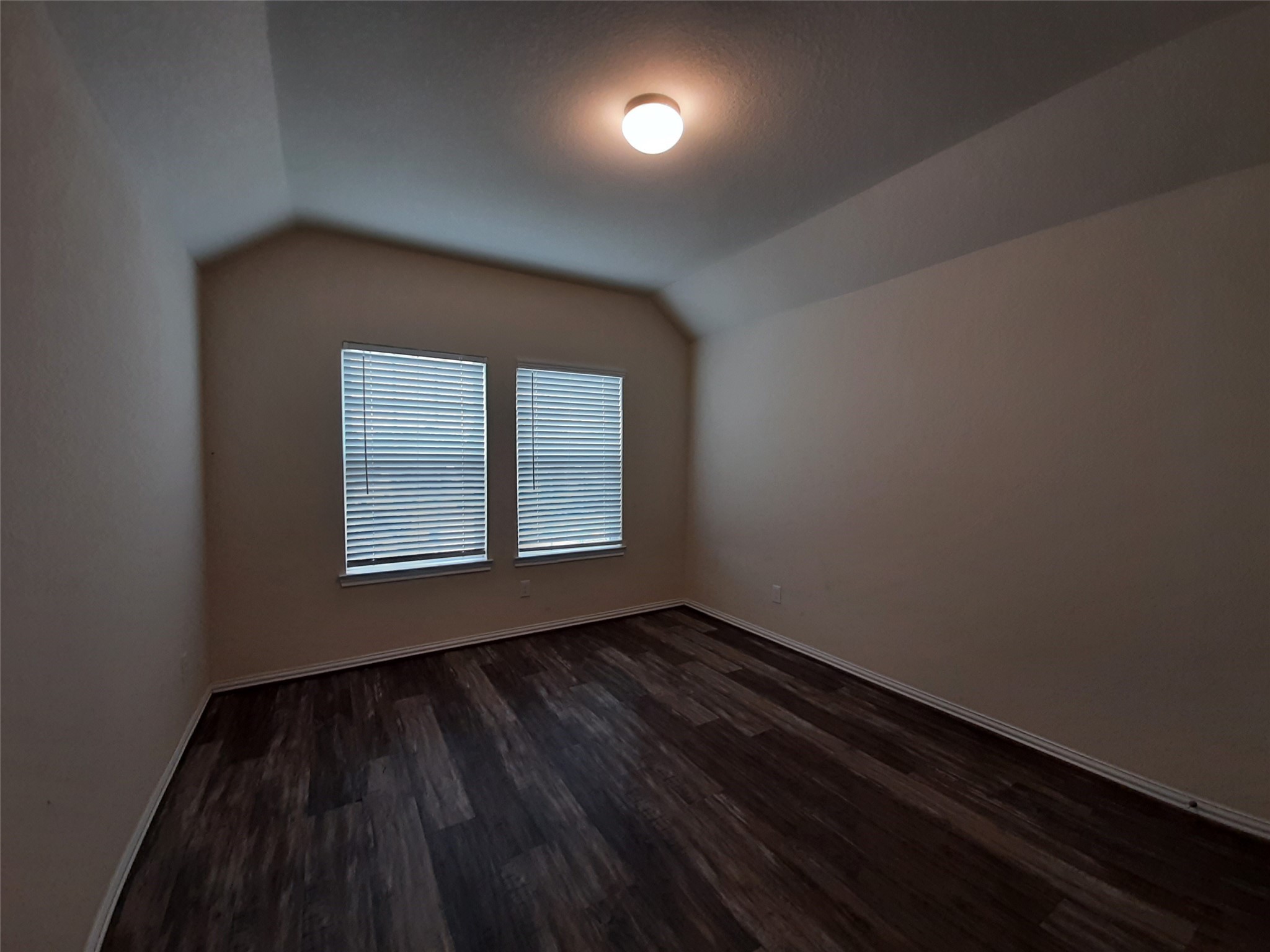 22830 Highland Bluff Lane Spring, TX 77373 - Photo 34 of 39 a view of an empty room with wooden floor and a window