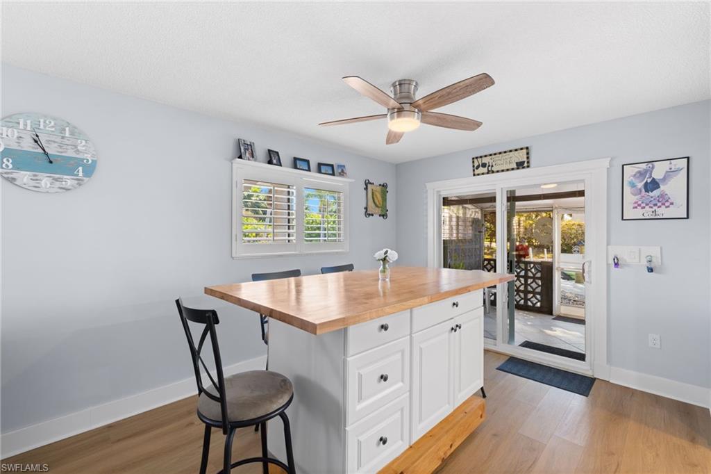 1686 Blue Point Avenue, Unit A1 Naples, FL 34102 - Photo 12 of 38 a kitchen with a counter space and a window