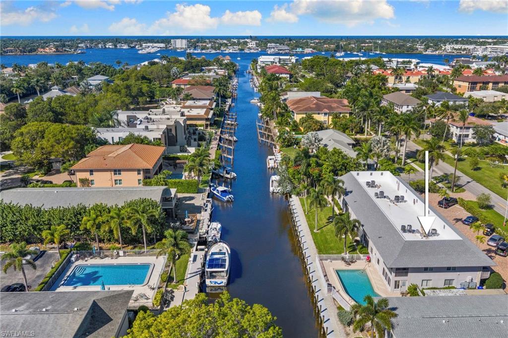 1686 Blue Point Avenue, Unit A1 Naples, FL 34102 - Photo 38 of 38 an aerial view of residential houses with outdoor space and swimming pool