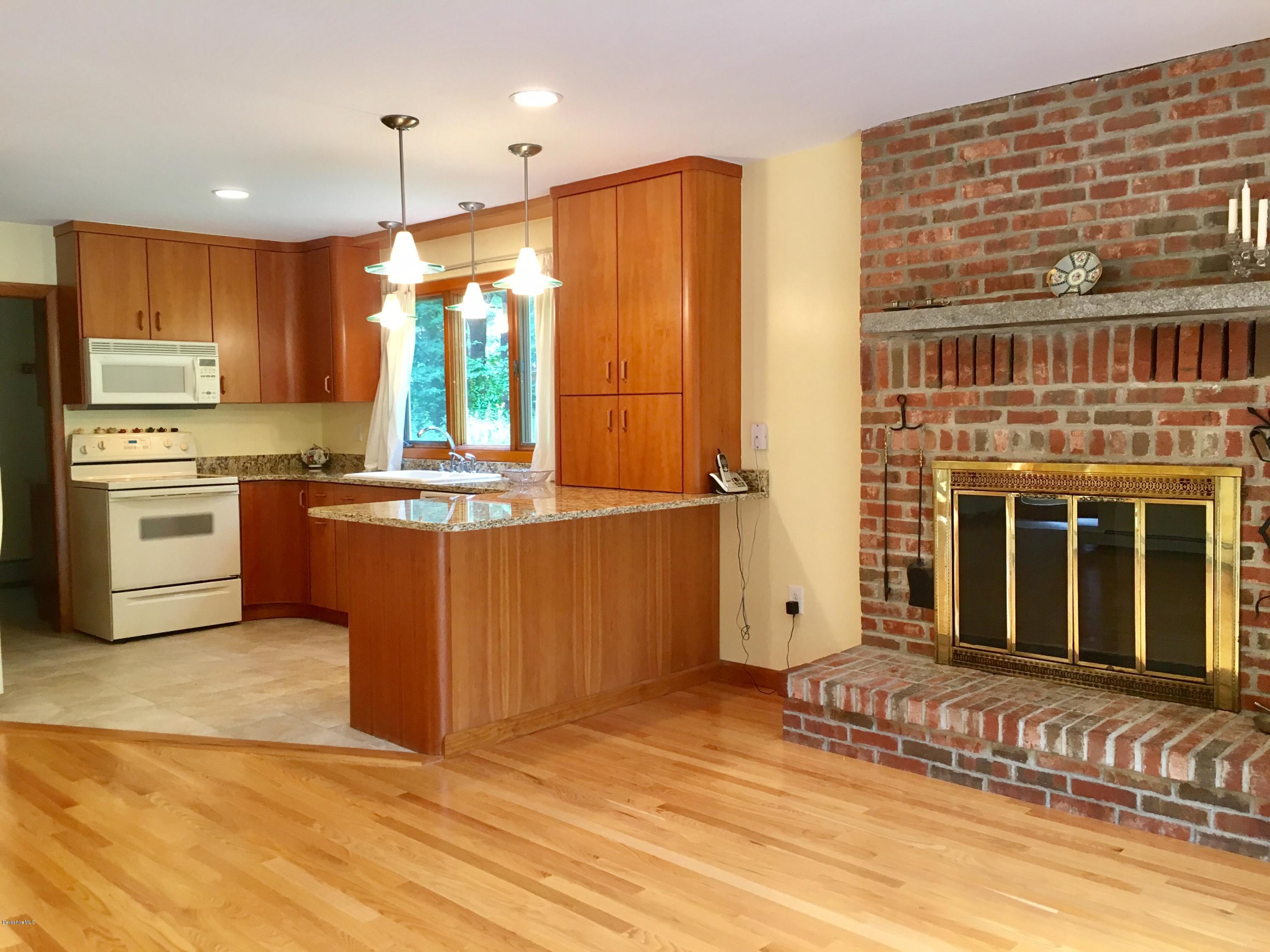 41 Pine Knoll Road Lenox, MA 01240 - Photo 13 of 37 a kitchen with stainless steel appliances granite countertop a refrigerator a stove and a sink