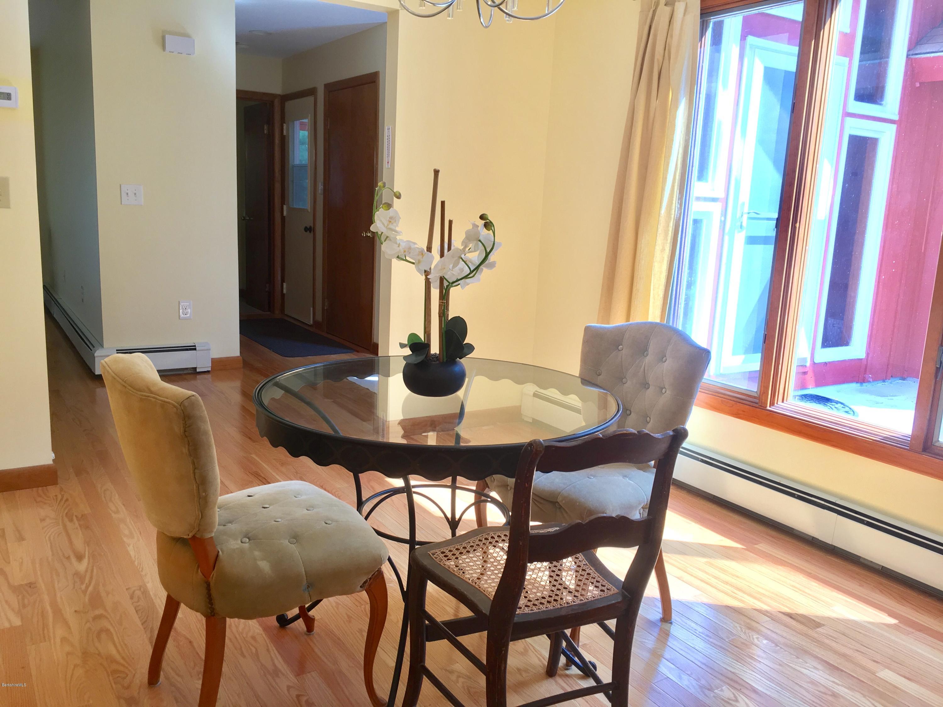 41 Pine Knoll Road Lenox, MA 01240 - Photo 20 of 37 a dining room with furniture and wooden floor