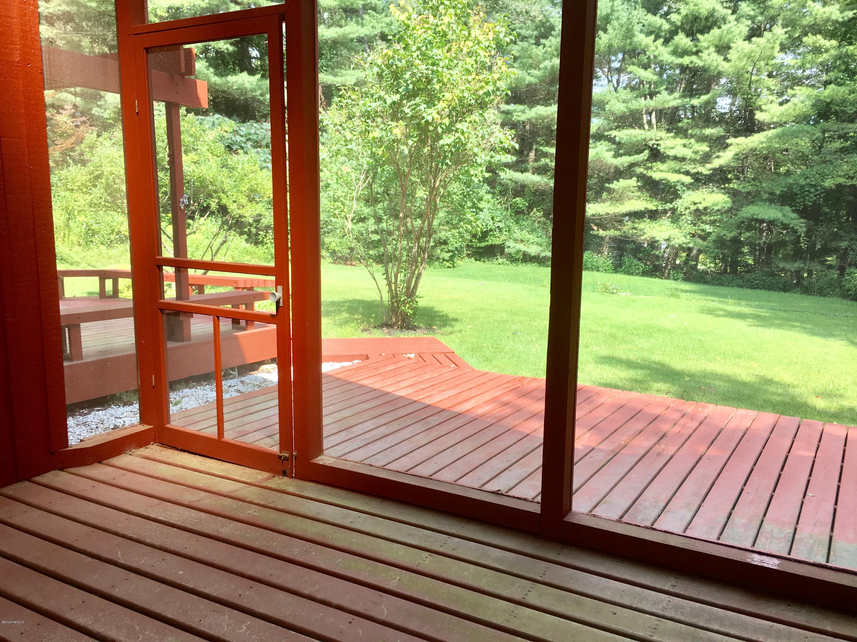 41 Pine Knoll Road Lenox, MA 01240 - Photo 21 of 37 a view of a wooden deck with a yard