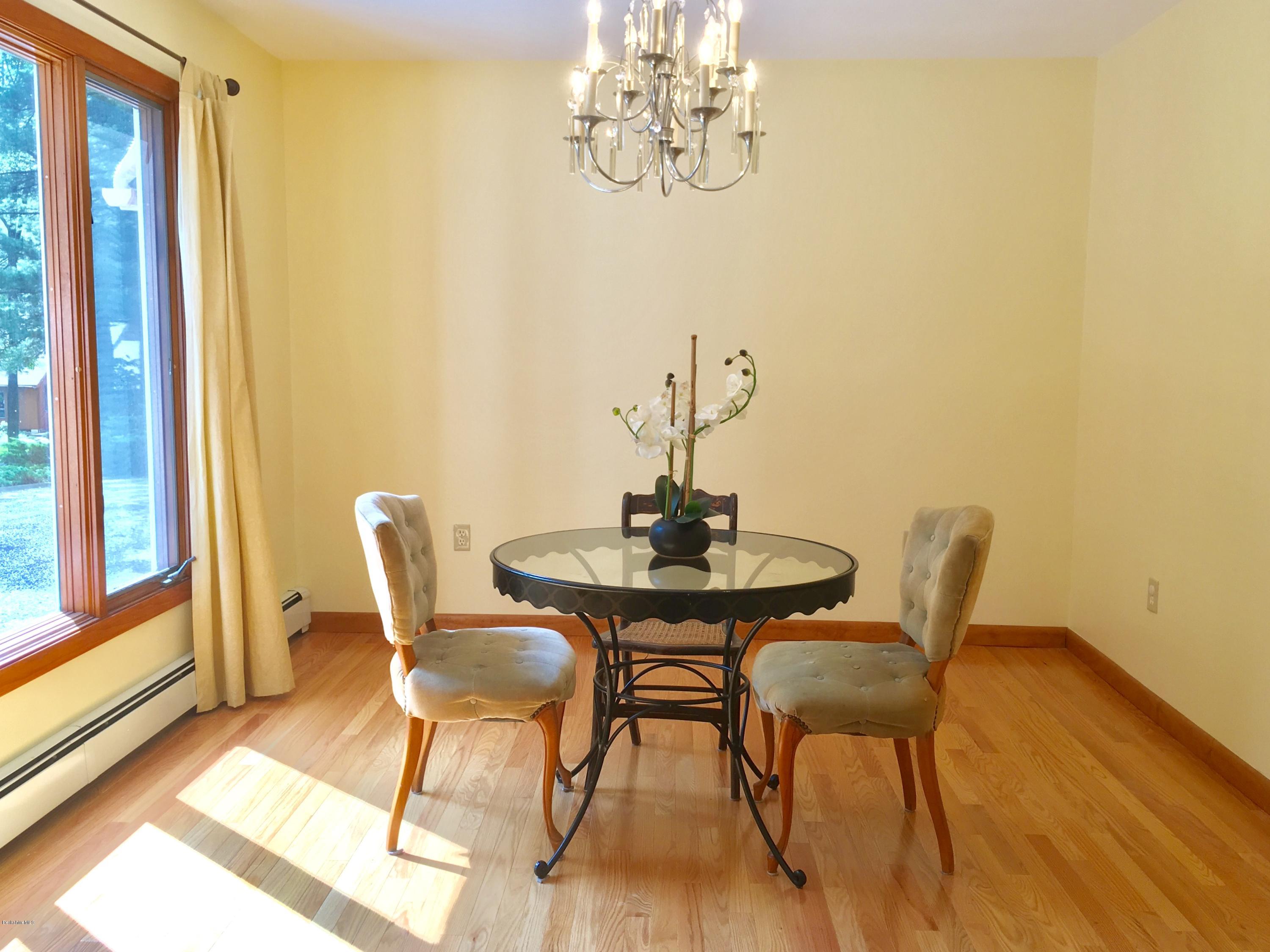 41 Pine Knoll Road Lenox, MA 01240 - Photo 4 of 37 a view of a dining room with furniture and wooden floor