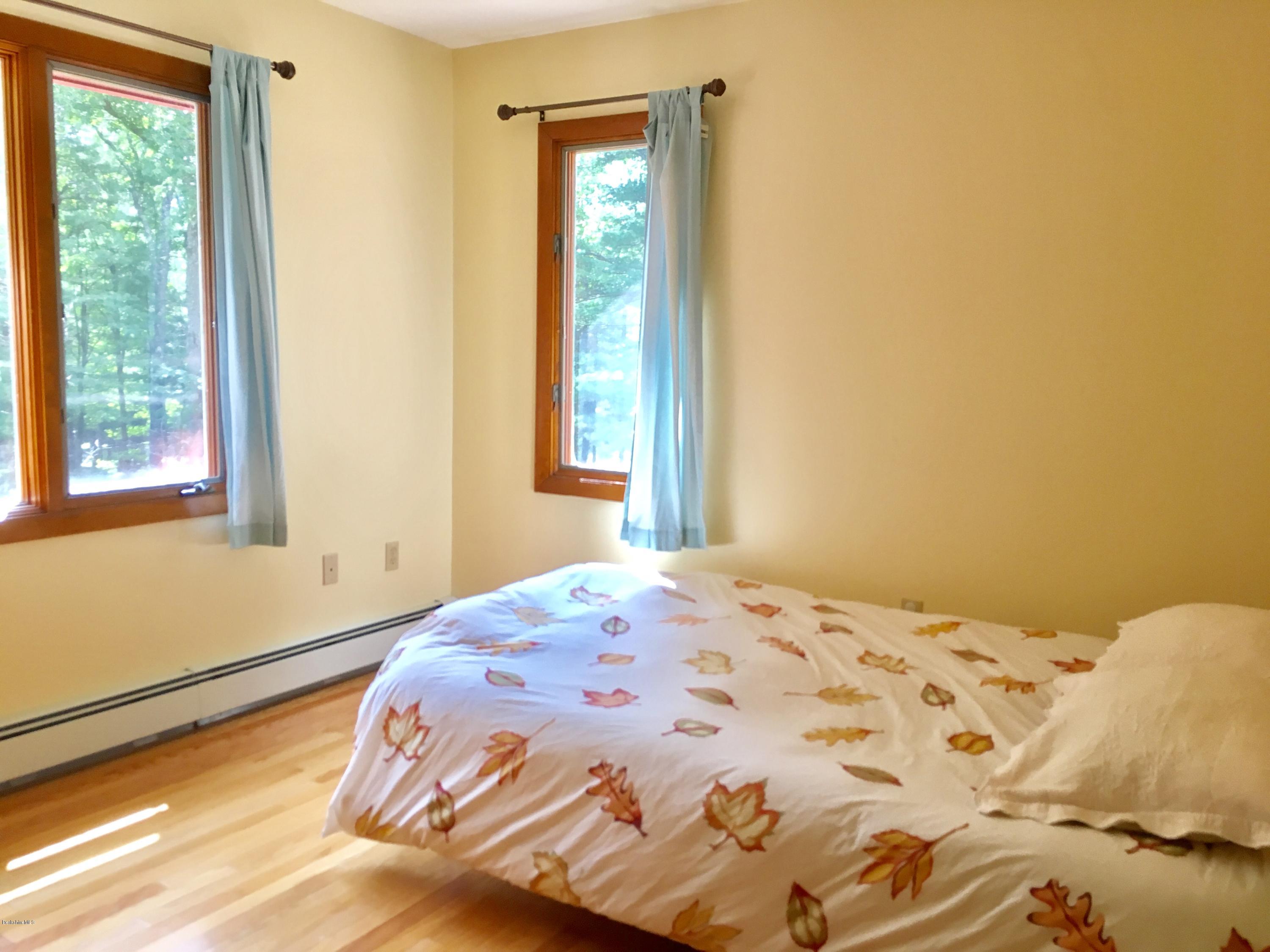 41 Pine Knoll Road Lenox, MA 01240 - Photo 9 of 37 a bedroom with a bed and a window