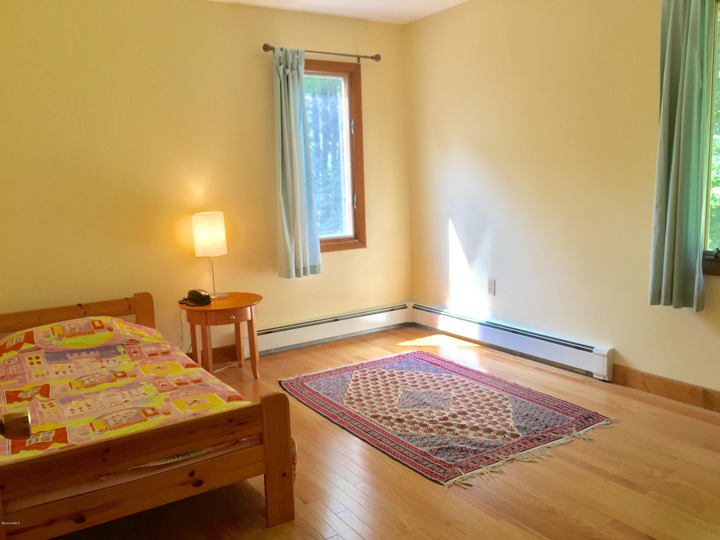 41 Pine Knoll Road Lenox, MA 01240 - Photo 10 of 37 a bedroom with a bed and a window