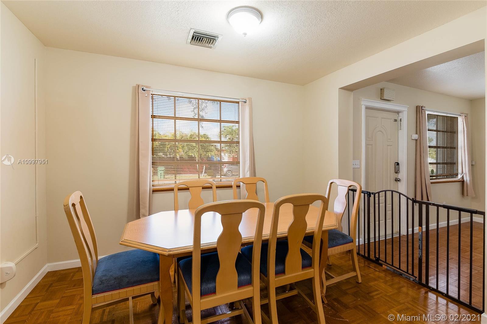 19931 Dothan Road Cutler Bay, FL 33157 - Photo 13 of 27 a view of a dining room with furniture window and outside view