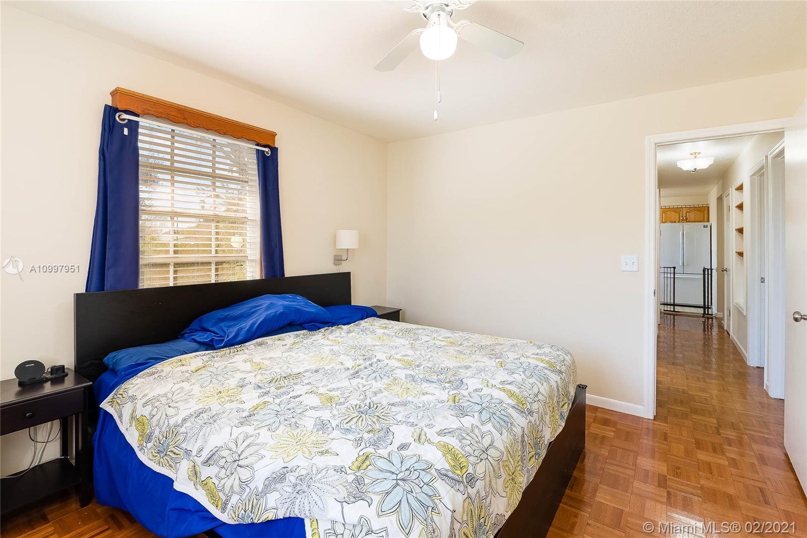 19931 Dothan Road Cutler Bay, FL 33157 - Photo 18 of 27 a bed sitting in a bedroom next to a window