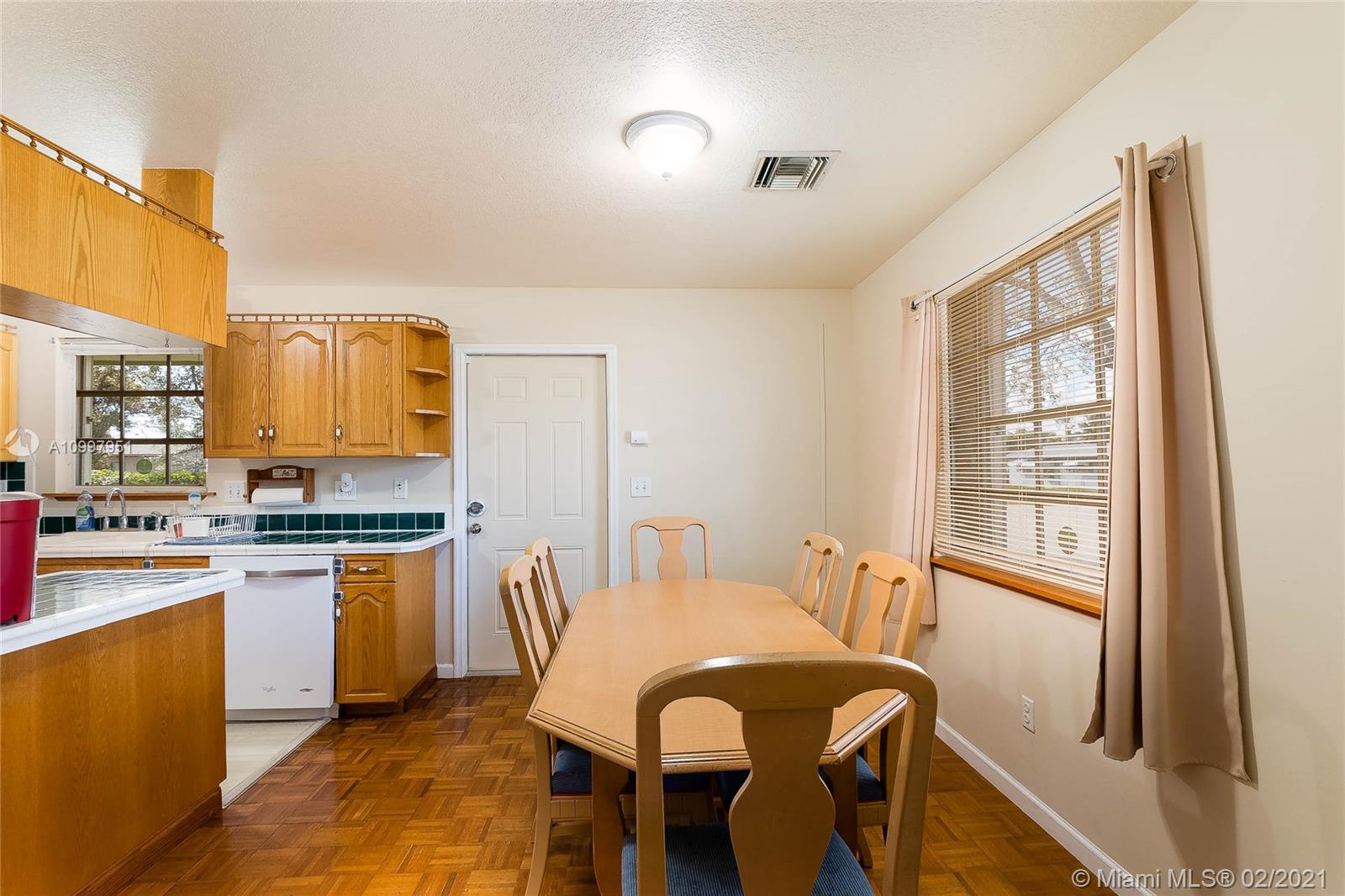 19931 Dothan Road Cutler Bay, FL 33157 - Photo 4 of 27 a view of a a dining room with furniture window and wooden floor