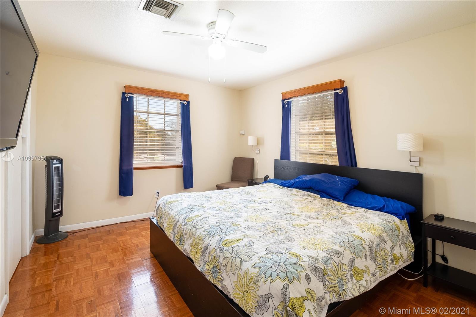 19931 Dothan Road Cutler Bay, FL 33157 - Photo 6 of 27 a bed sitting in a spacious bedroom next to a window