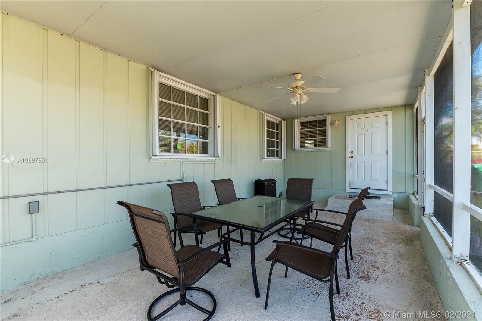 19931 Dothan Road Cutler Bay, FL 33157 - Photo 9 of 27 a view of a dining room with furniture and window