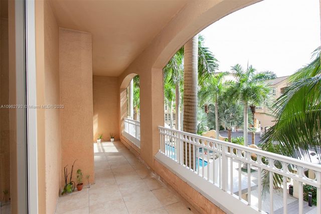 a view of a balcony with furniture