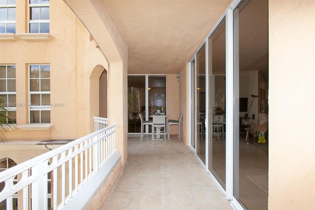 a view of a porch with wooden floor and stairs