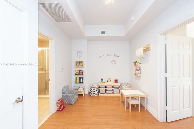 a bedroom with a bed and a table in it