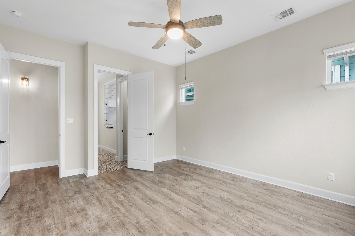 1046 Hazy Hills Loop Dripping Springs, TX 78620 - Photo 11 of 35 wooden floor in an empty room