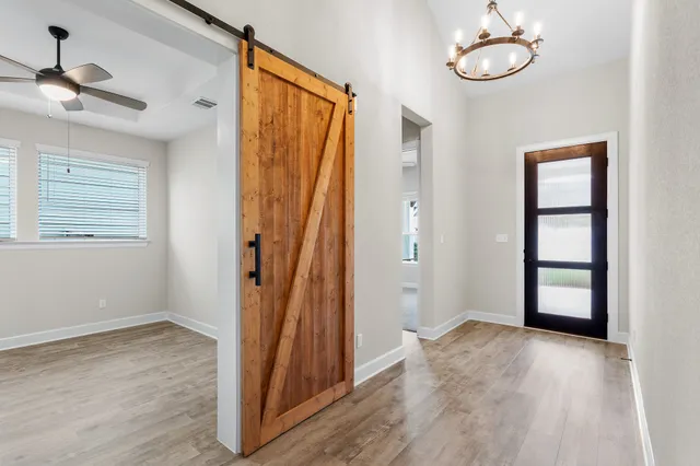 a view of cabinets with racks on the wall