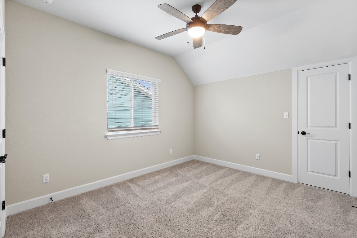 1046 Hazy Hills Loop Dripping Springs, TX 78620 - Photo 23 of 35 wooden floor in an empty room with a window