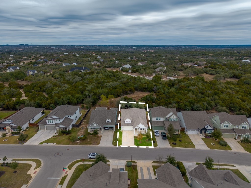 1046 Hazy Hills Loop Dripping Springs, TX 78620 - Photo 28 of 35 an aerial view of residential houses with outdoor space