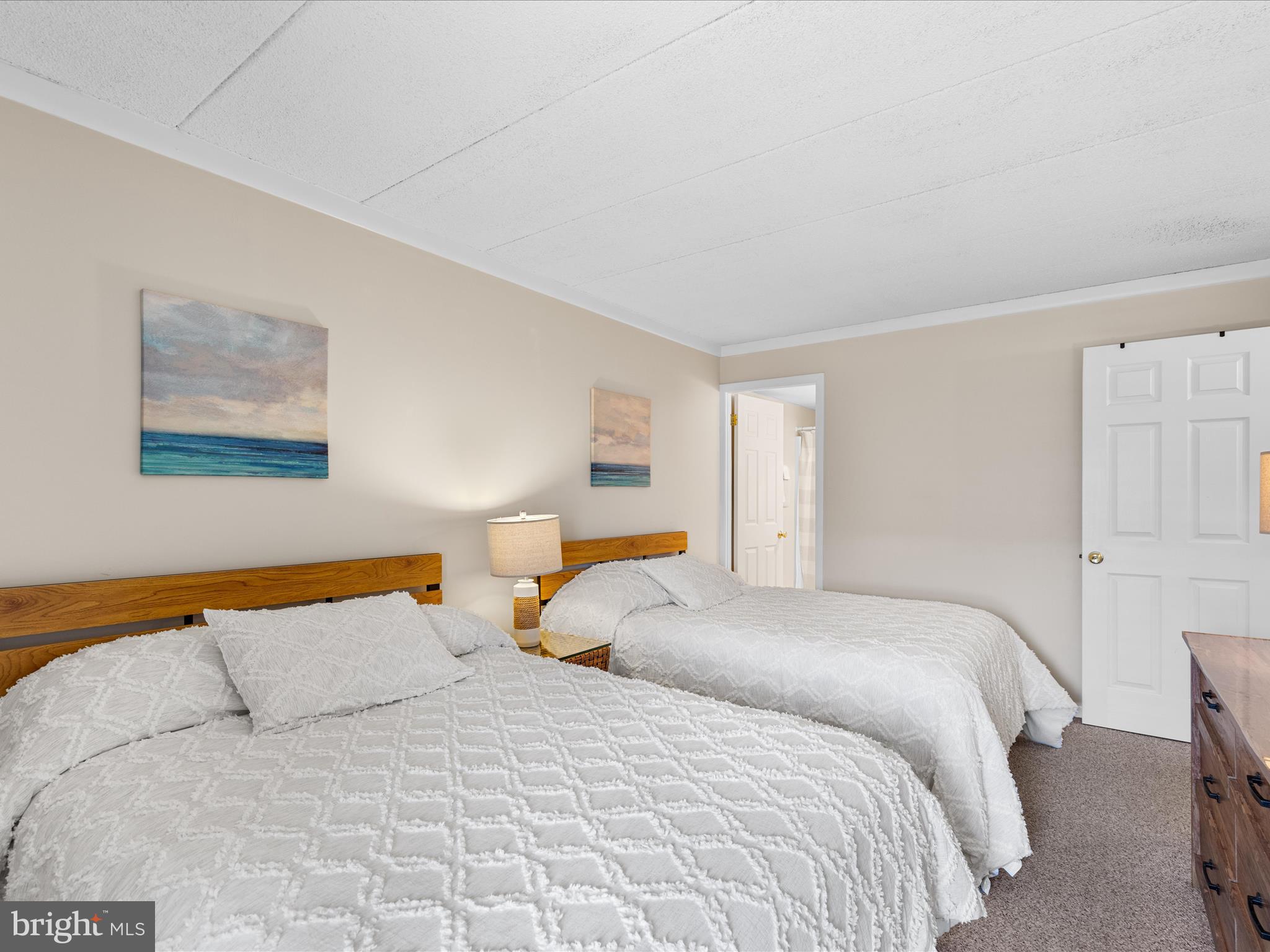 17 70th Street, Unit 25 Ocean City, MD 21842 - Photo 24 of 37 a bedroom with a bed and wall painting